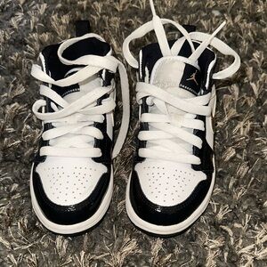Jordan 1s Kids Black and White High-Top Sneakers